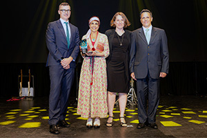 Four members of the Audiology Advanced Scope Practitioner Project stand onstage to accept a WA Health Excellence Award