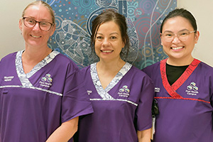 Three Peel Health Campus midwives stand together