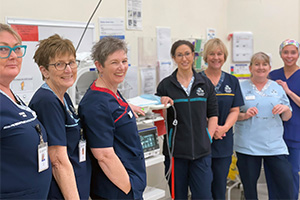 Seven nurses from the Day Surgery Unit at Peel Health Campus stand together